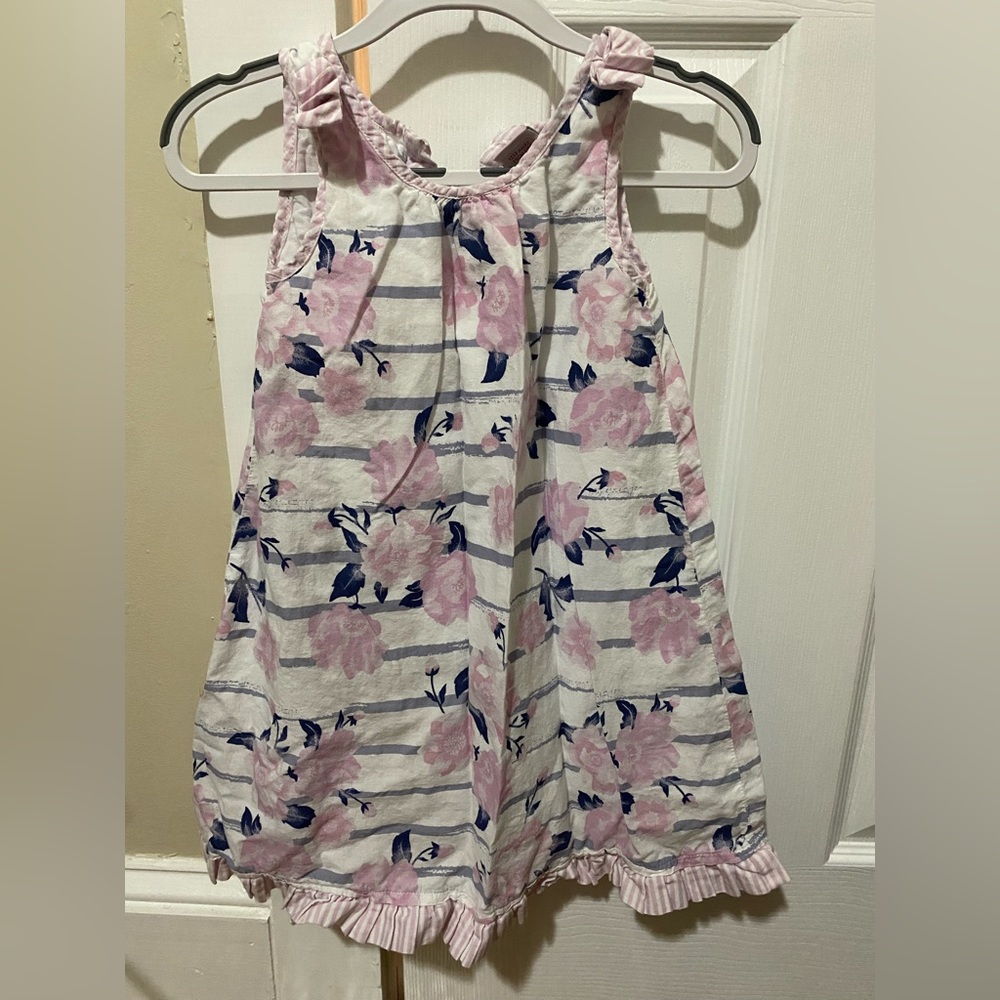 White and pink sleeveless dress with blue floral designs
